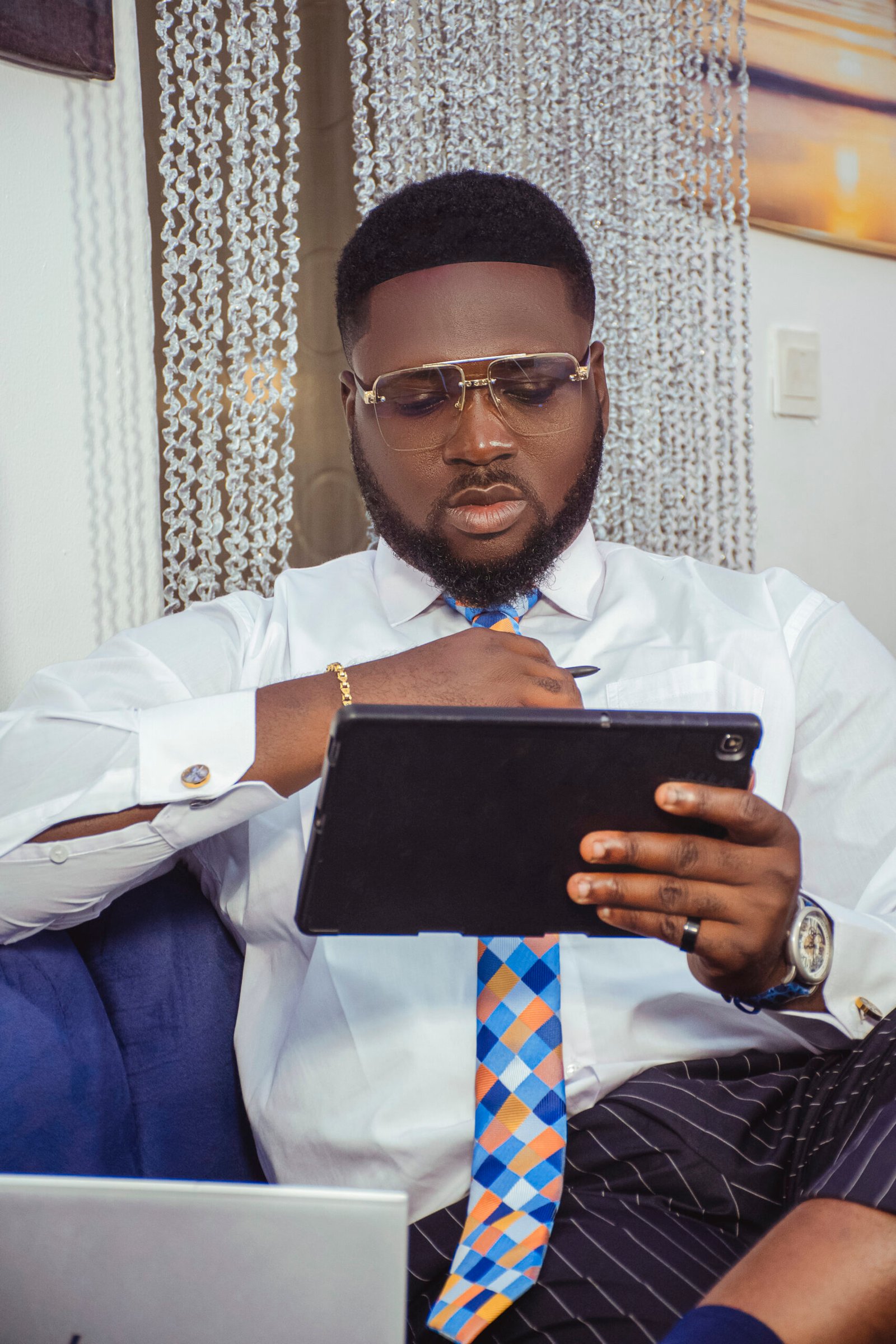 Apostle Samson Dunamis working on laptop